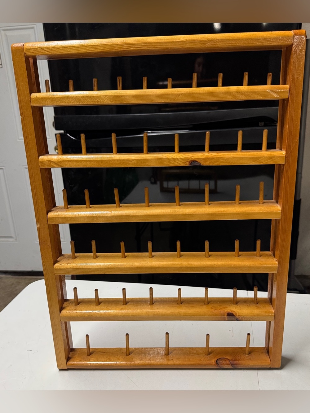 Vintage wall mounted wood thread rack